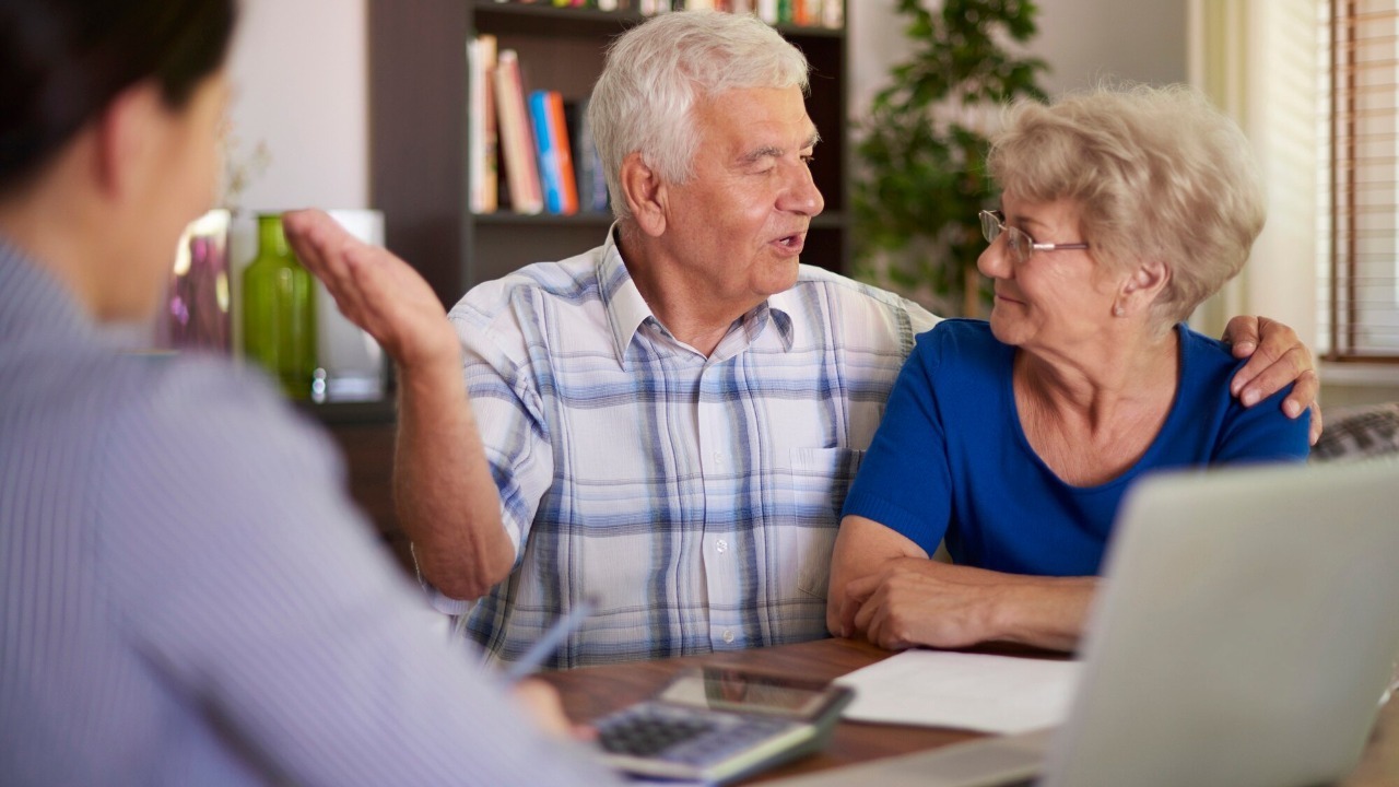 Senior couple making a financial deal