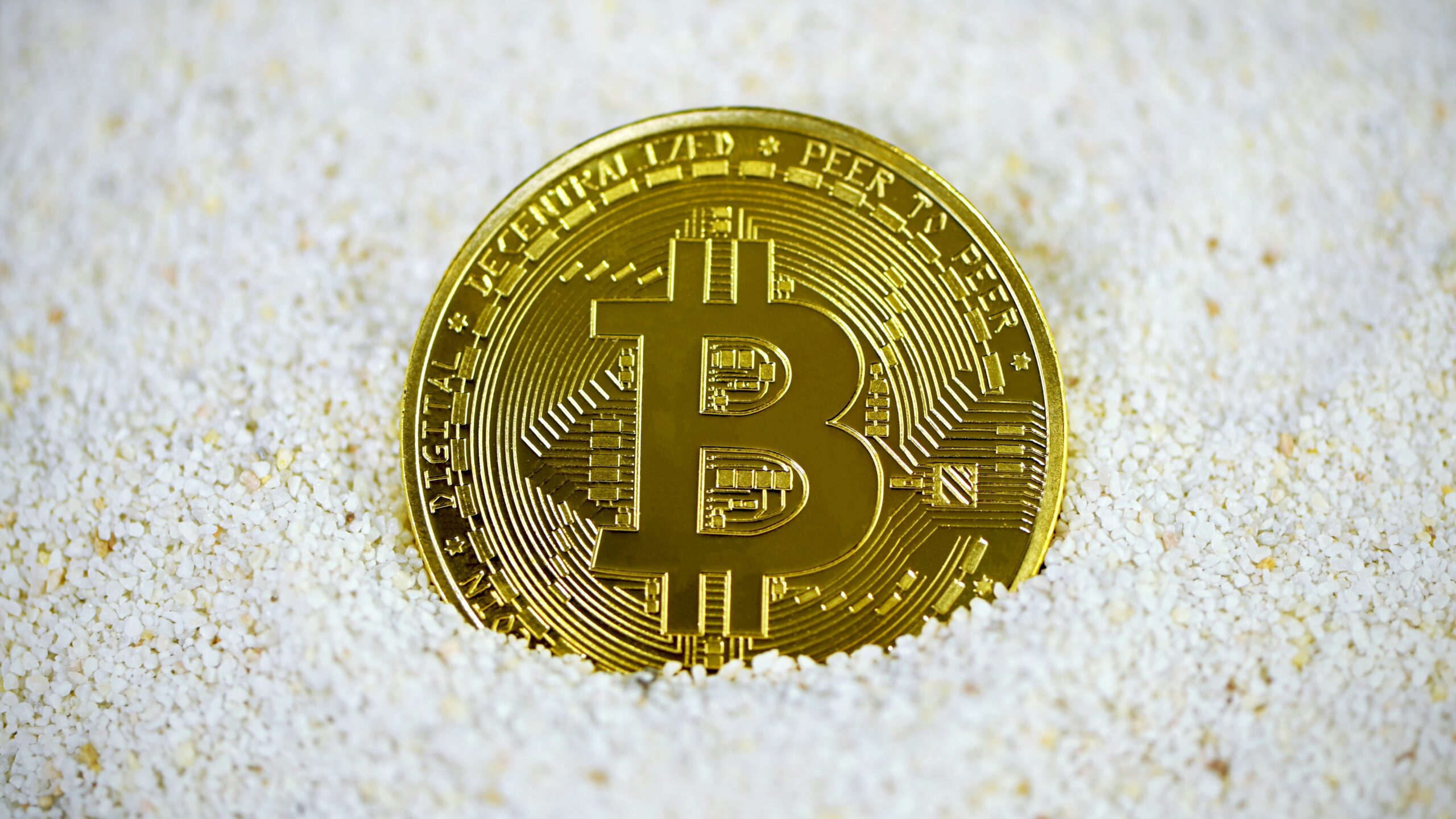 gold and black round coin