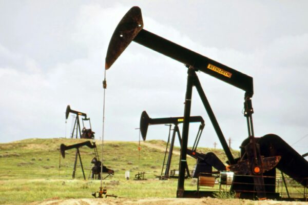 a group of oil pumps sitting on top of a field