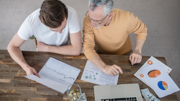 Two men working together on a project and looking concentrated