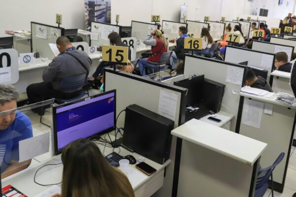 a room full of people working on computers