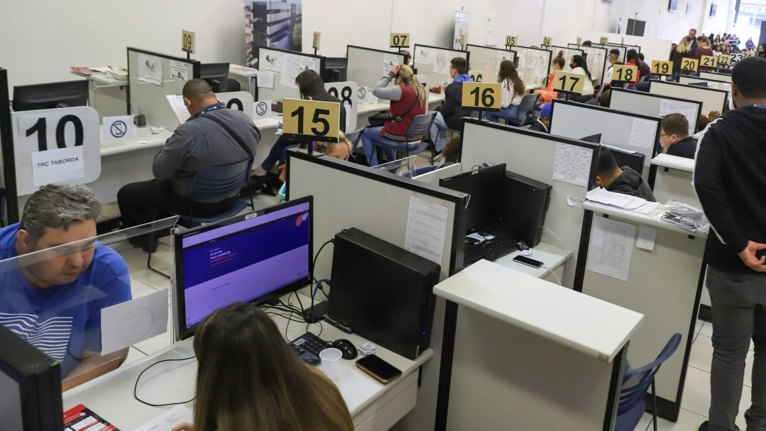 a room full of people working on computers