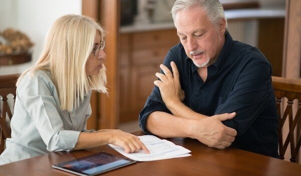Senior couple calculating their living expenses together
