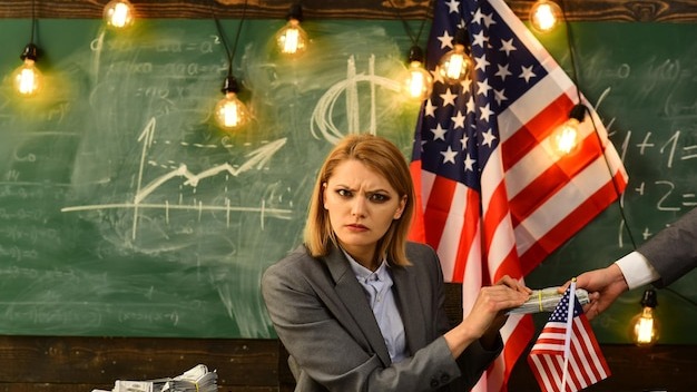 Politician woman Offering Stack Of US Money To man