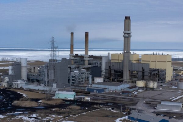 a factory with a lot of smoke coming out of it