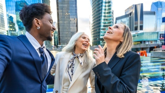 Diverse business team colleagues enjoying a laugh outdoors