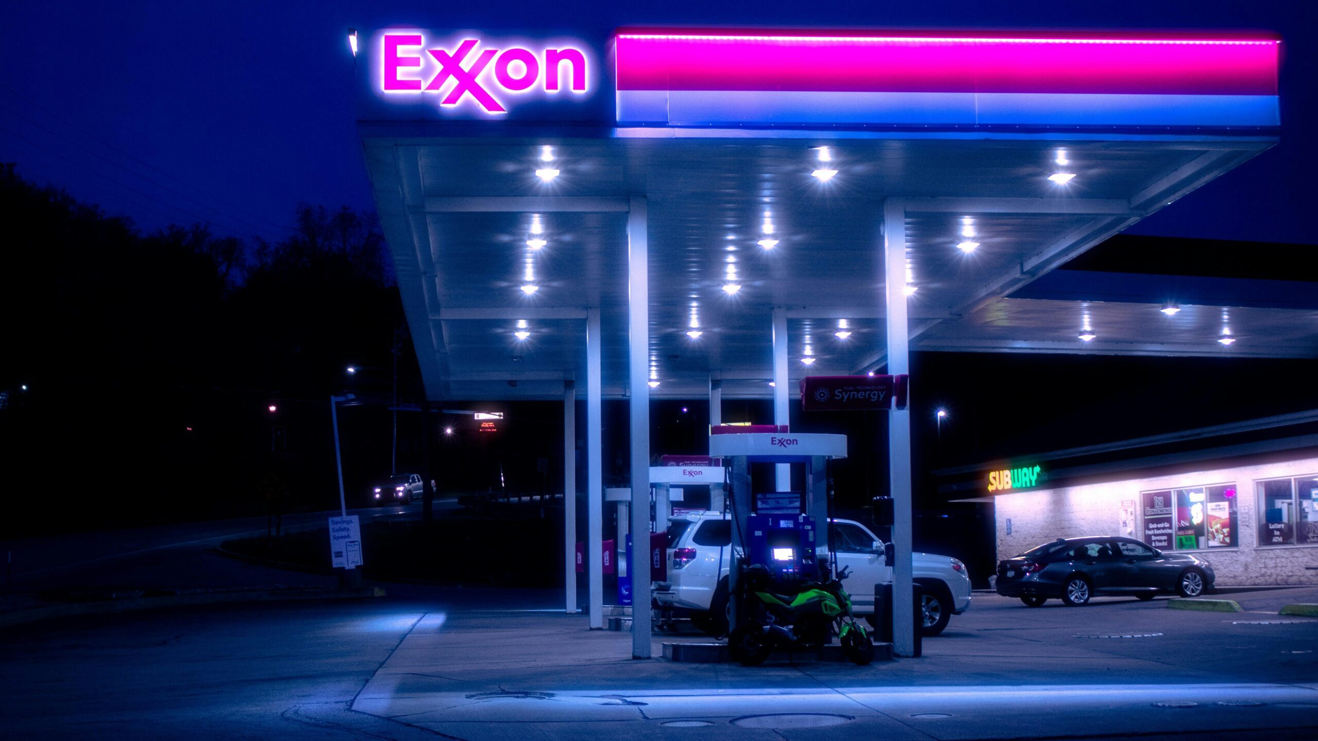 cars parked in front of UNKs store during night time