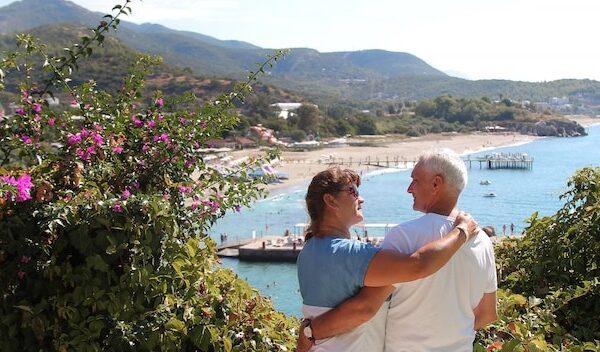 The concept of a romantic walk. A couple in love holding hands.