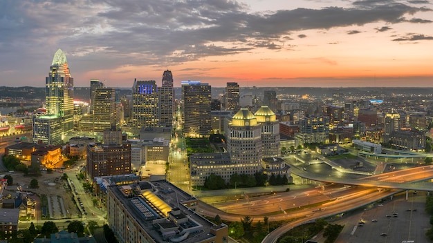 Downtown district of Cincinnati in Ohio USA at night with brightly illuminated high skyscraper buildings American travel destination