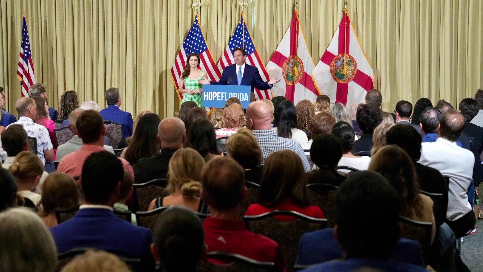 Governor Ron DeSantis and First Lady Casey DeSantis at a Hope Florida conference