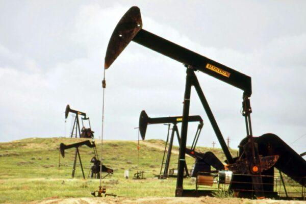 a group of oil pumps sitting on top of a field
