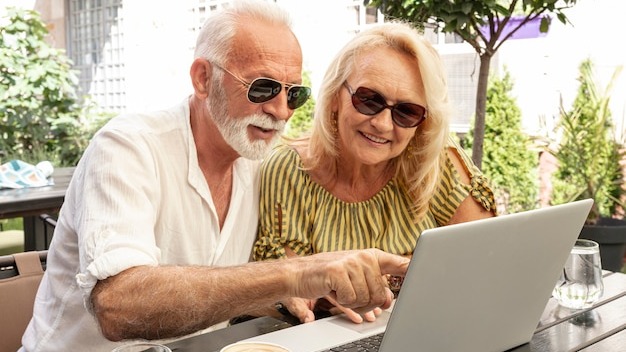 Man showing to laptop to his woman