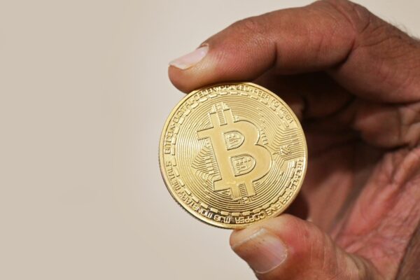 Holding Bitcoin cryptocurrency coin