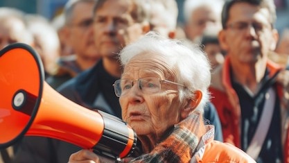 Man addressing a crowd with a megaphone