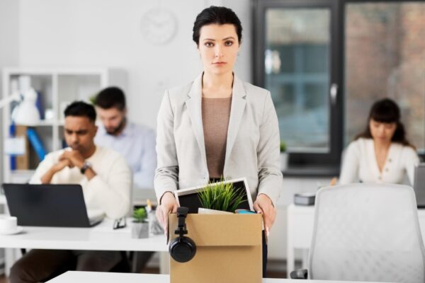 female office worker with box of personal stuff