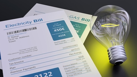 Electricity bill and light bulb household cost increase concept