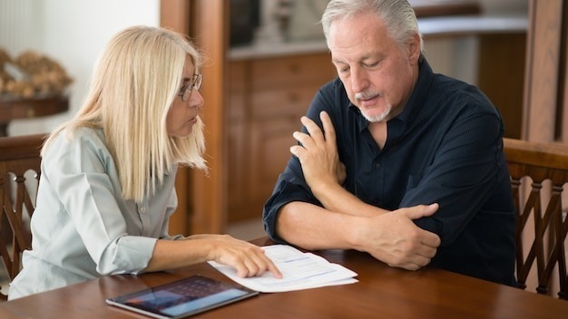 Senior couple calculating their living expenses together