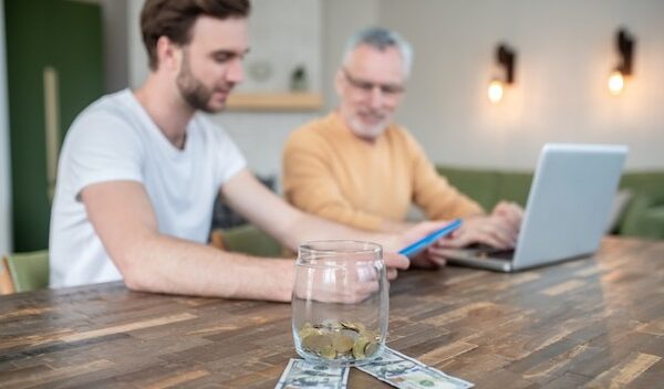 Home office. Two men working in a home office and looking involved