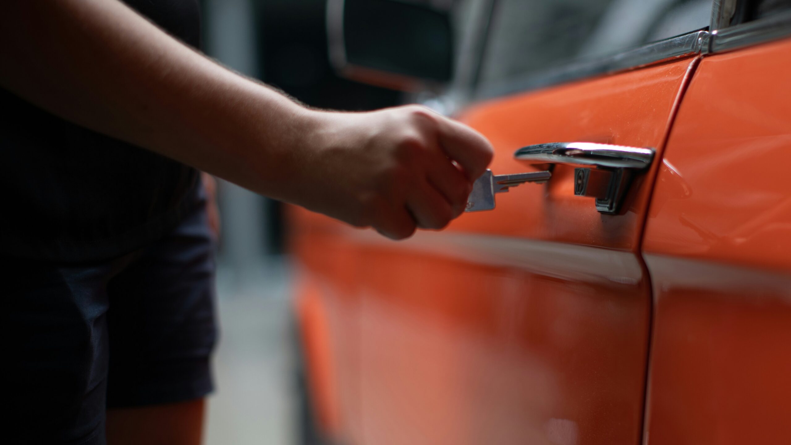 woman riding on vehicle holding 5 banknote