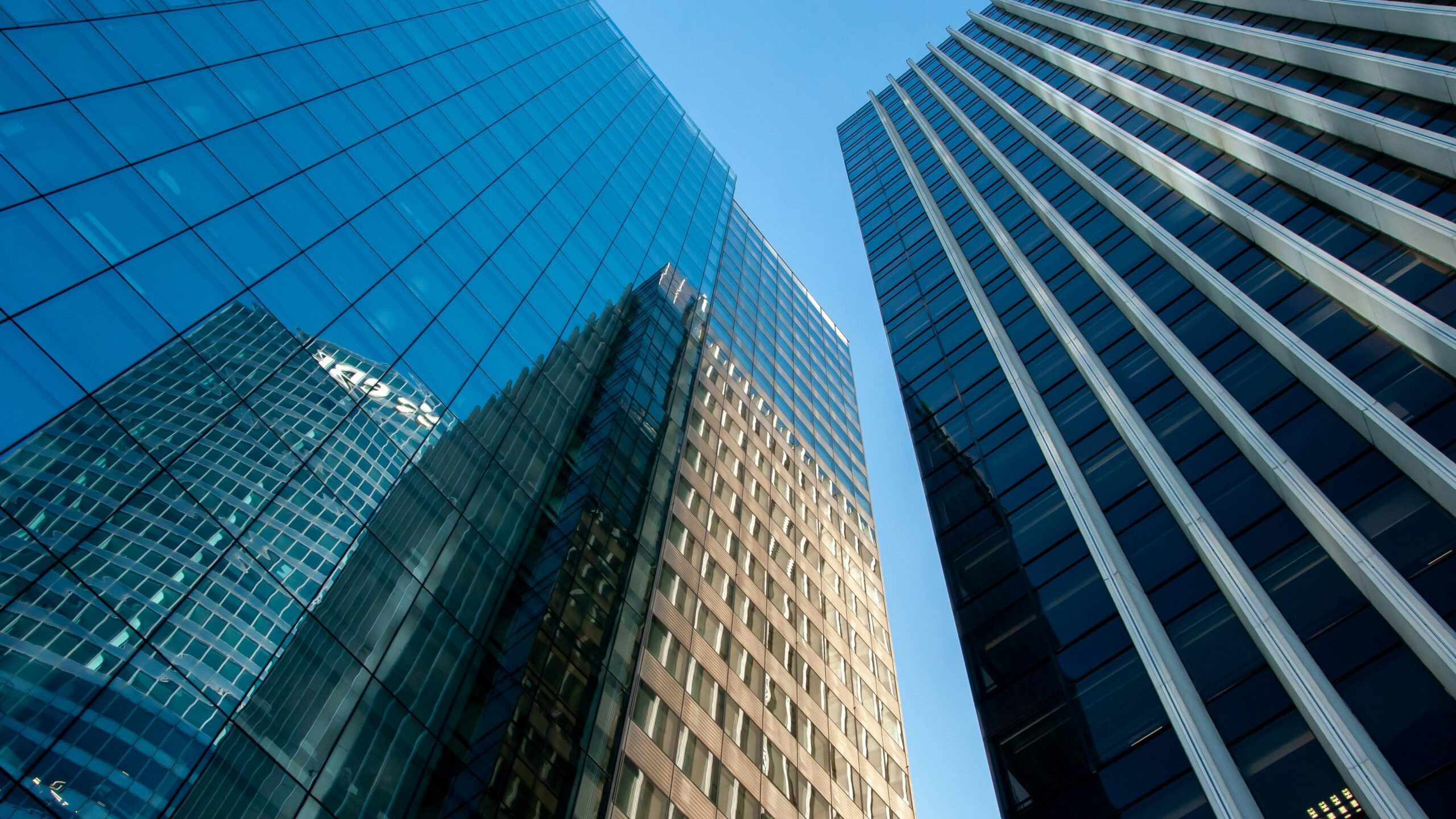 blue glass walled high rise building