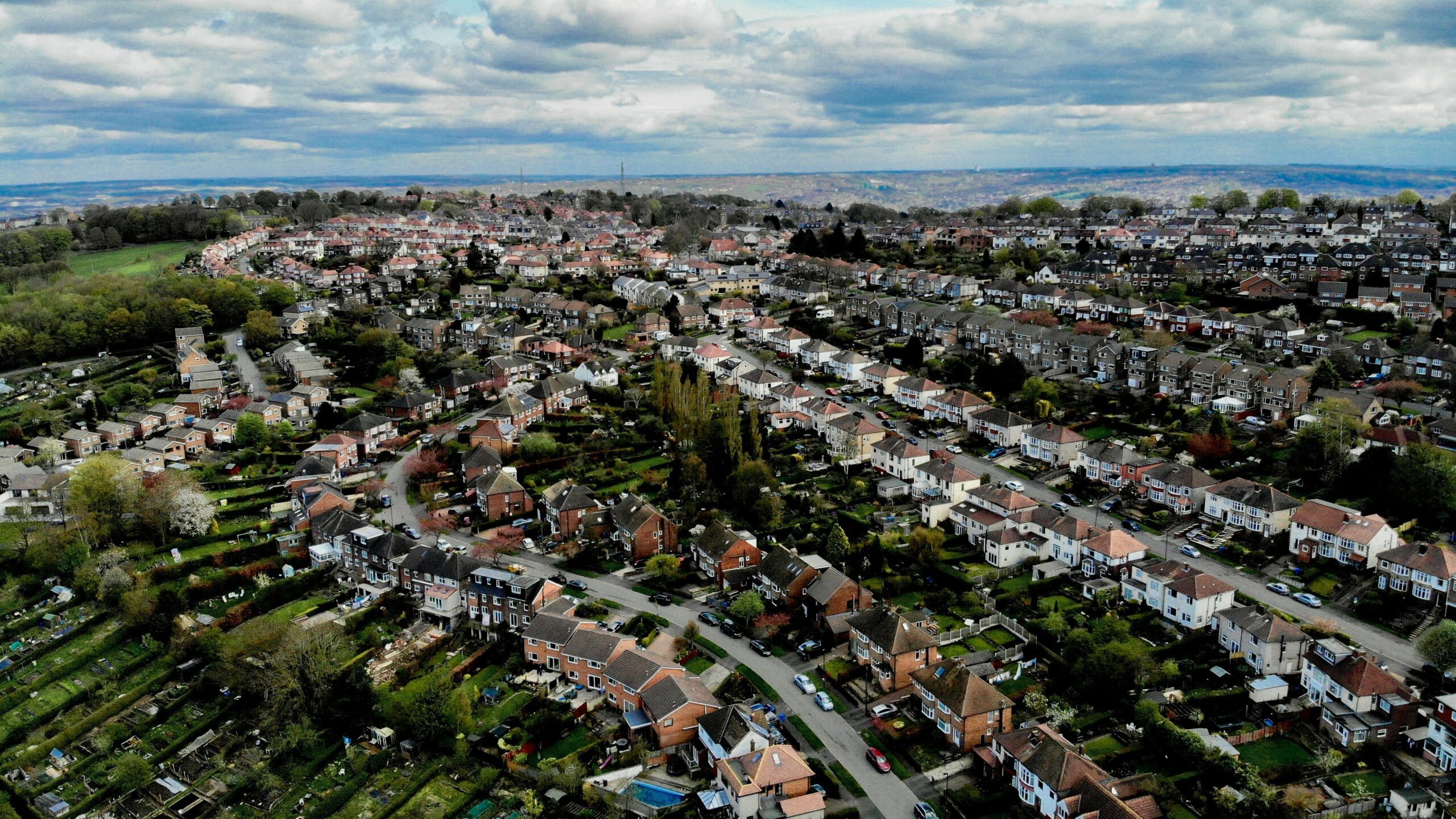 an aerial view of a city with lots of houses