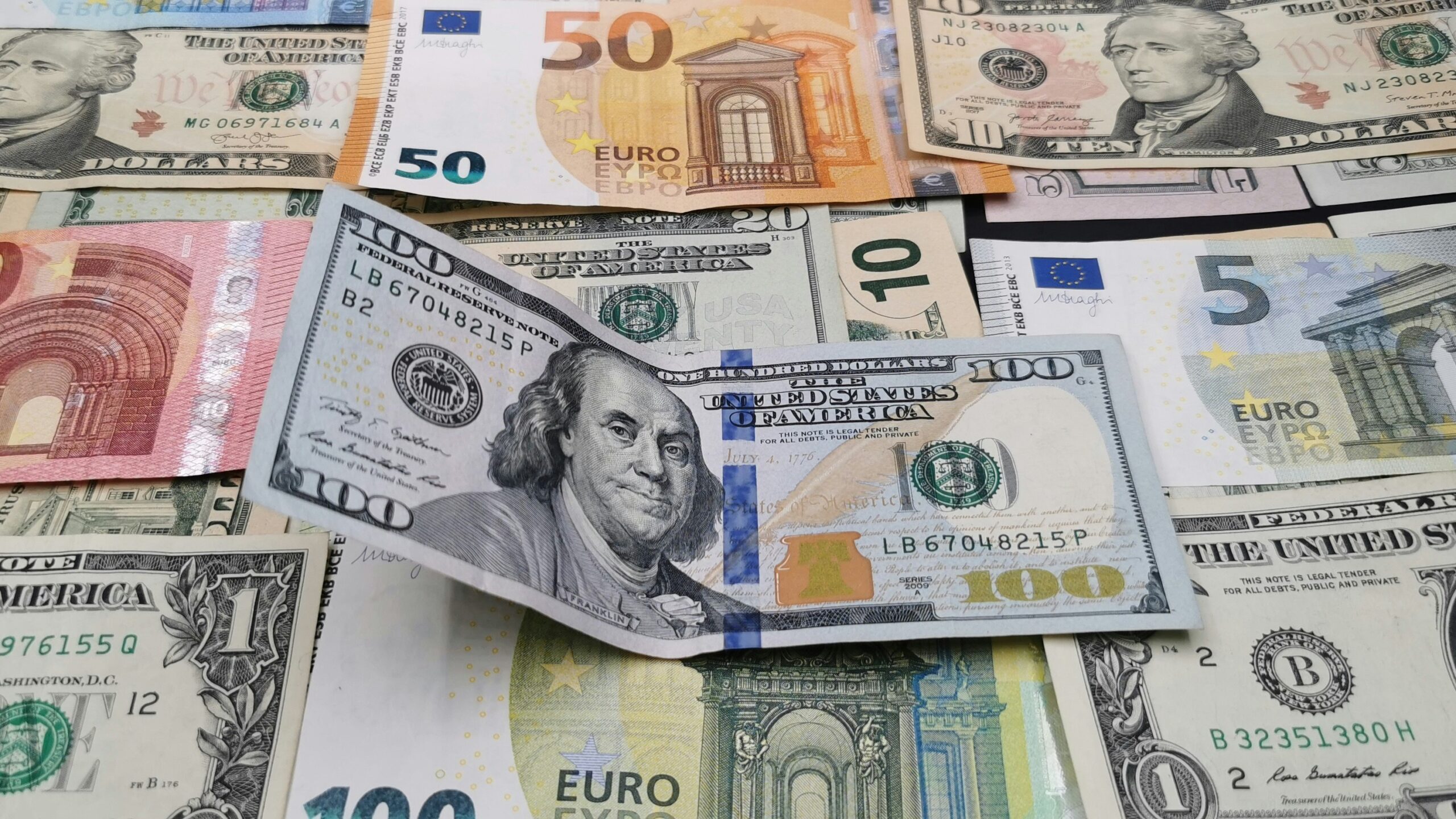 a pile of money sitting on top of each other