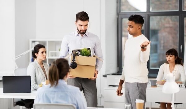 fired sad male office worker leaving