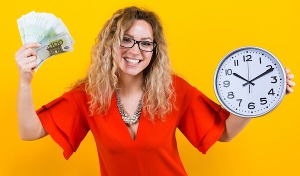Woman in dress with clocks and fan of banknotes