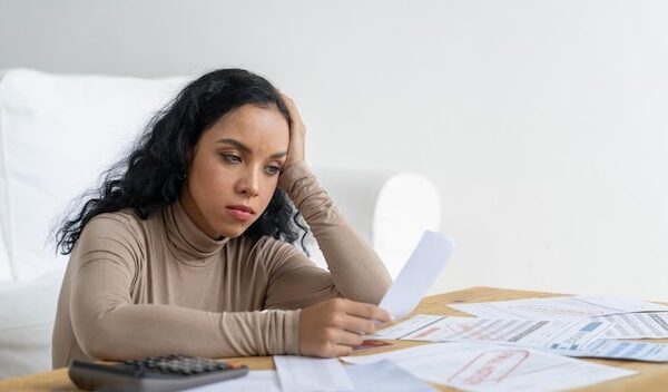 Stressed young woman has financial problems with credit card debt to pay crucial show concept of bad personal money and mortgage pay management crisis