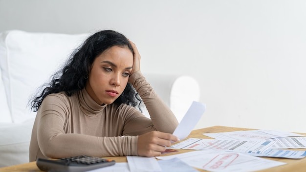 Stressed young woman has financial problems with credit card debt to pay crucial show concept of bad personal money and mortgage pay management crisis