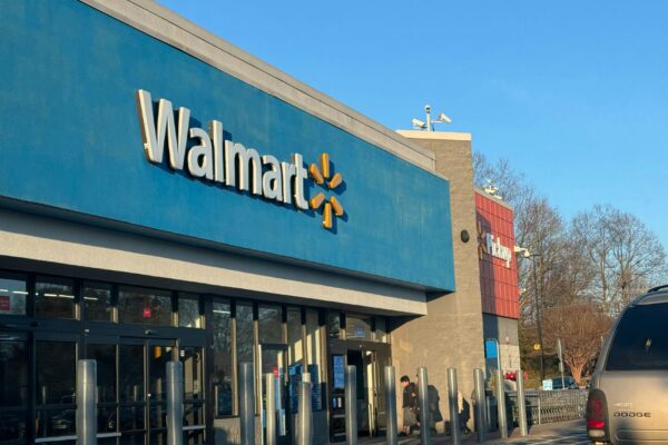 a walmart store with a car parked in front of it