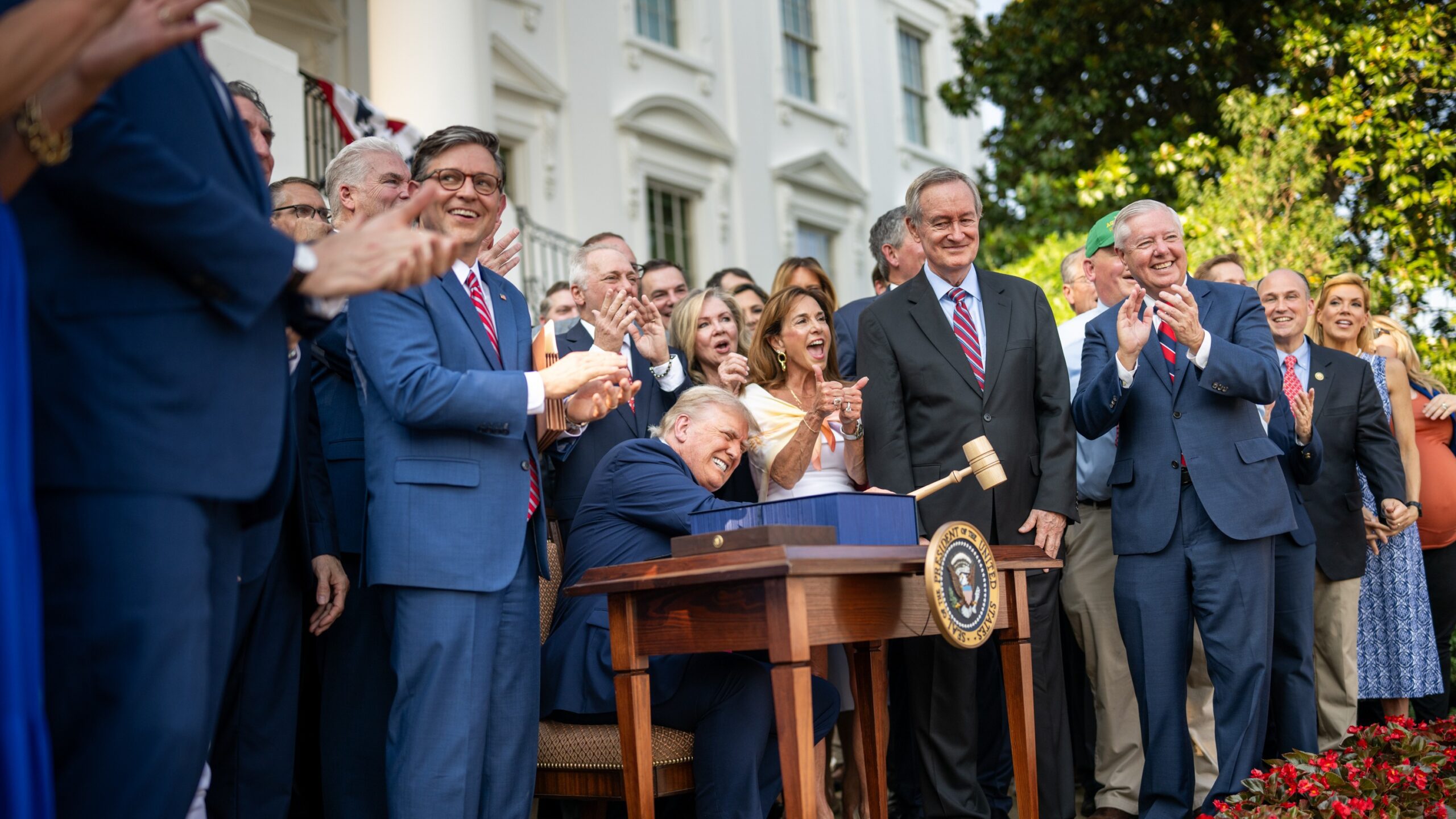 President Donald Trump hammers a gavel after signing the One Big Beautiful Bill Act on the South Lawn of the White House (54635043475)