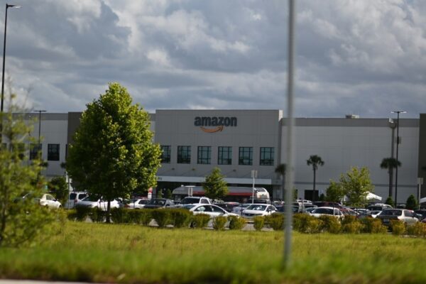 cars parked on parking lot near building during daytime