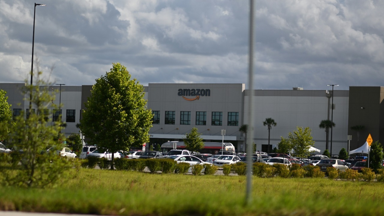 cars parked on parking lot near building during daytime