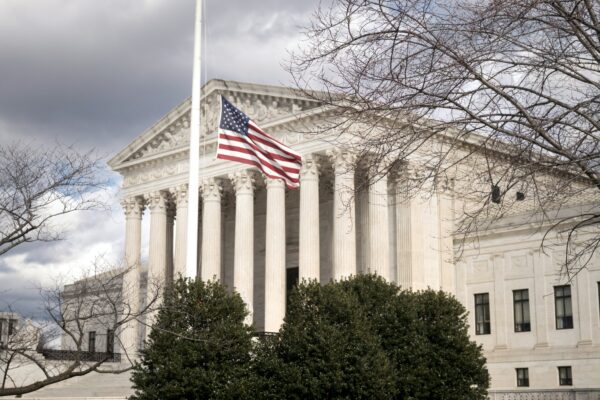 a large building with a flag on top of it
