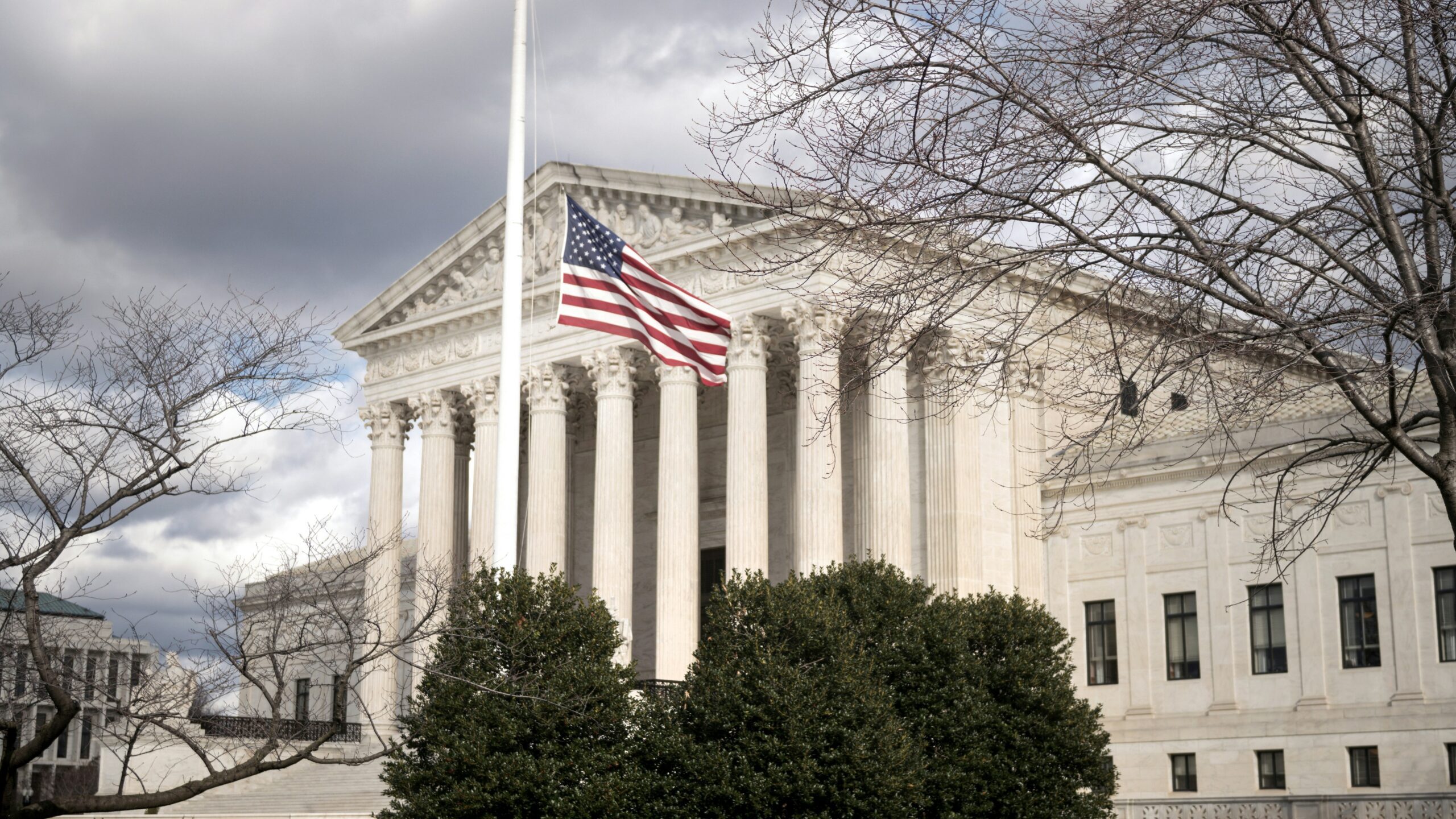 a large building with a flag on top of it