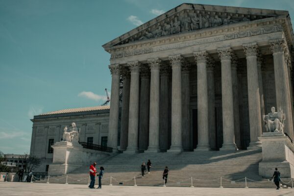 a group of people standing in front of a building