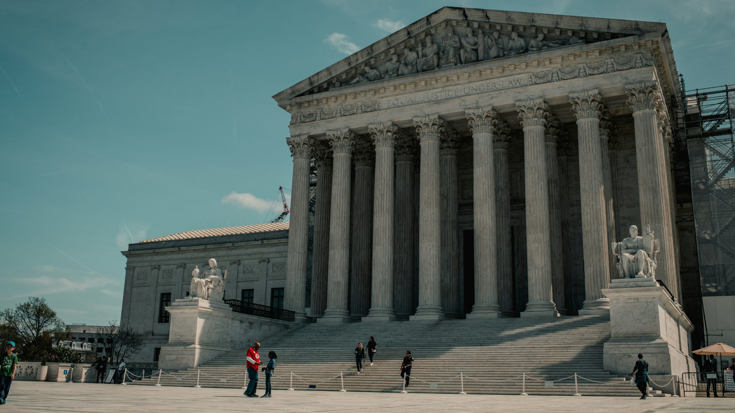 a group of people standing in front of a building