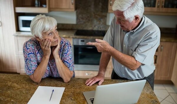 Senior couple arguing in kitchen at home