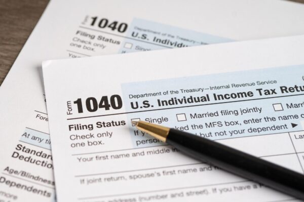 Tax Return form 1040 with pen US Individual Income
