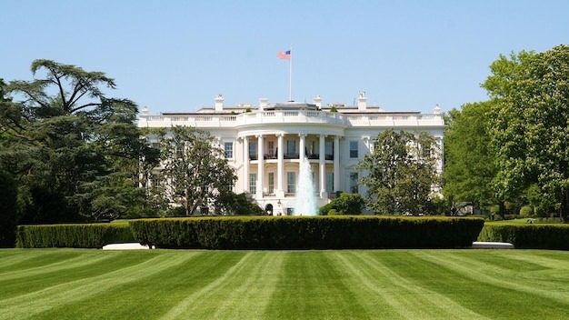a white house with a flag on the top