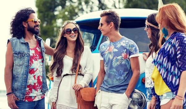summer holidays, road trip, vacation, travel and people concept - smiling young hippie friends over minivan car