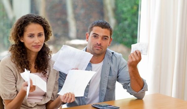 Young couple calculating their domestic bills