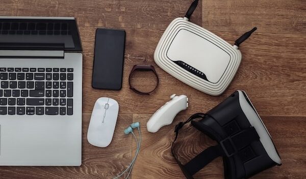 Modern youth gadgets and devices on wooden background. Top view. Flat lay