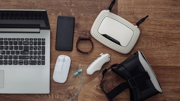 Modern youth gadgets and devices on wooden background. Top view. Flat lay