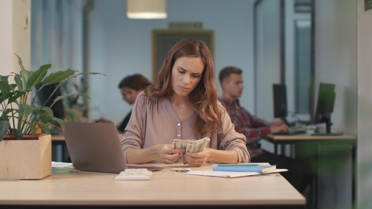 Business woman counting cash money Professional worker checking amount of money