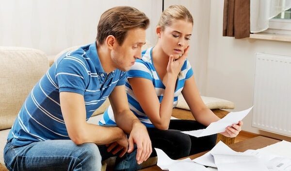 Couple discussing documents at home