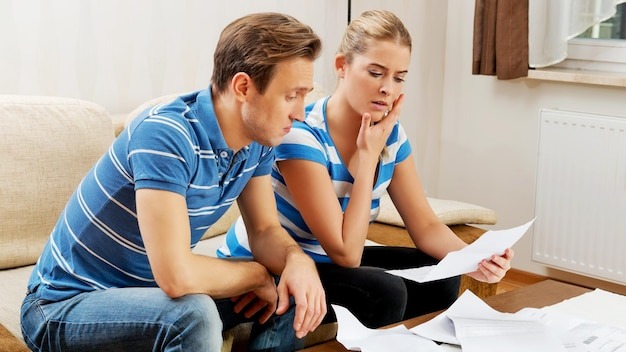 Couple discussing documents at home