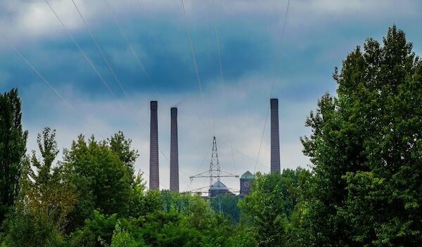 Low angle view of electricity pylon against sky