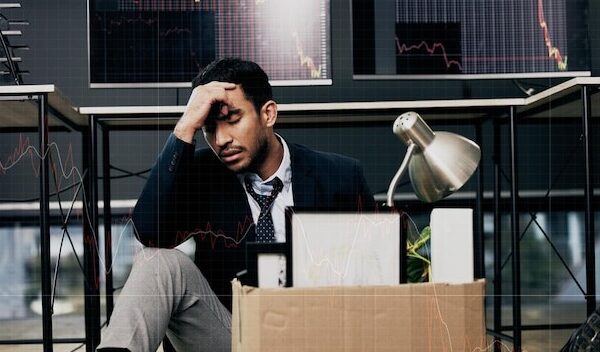 Failure should be our teacher, not our undertaker. Shot of a young businessman looking depressed after being retrenched from work in a office.